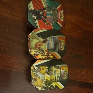 Pokemon Trading Card Tins - Black, Red, Yellow